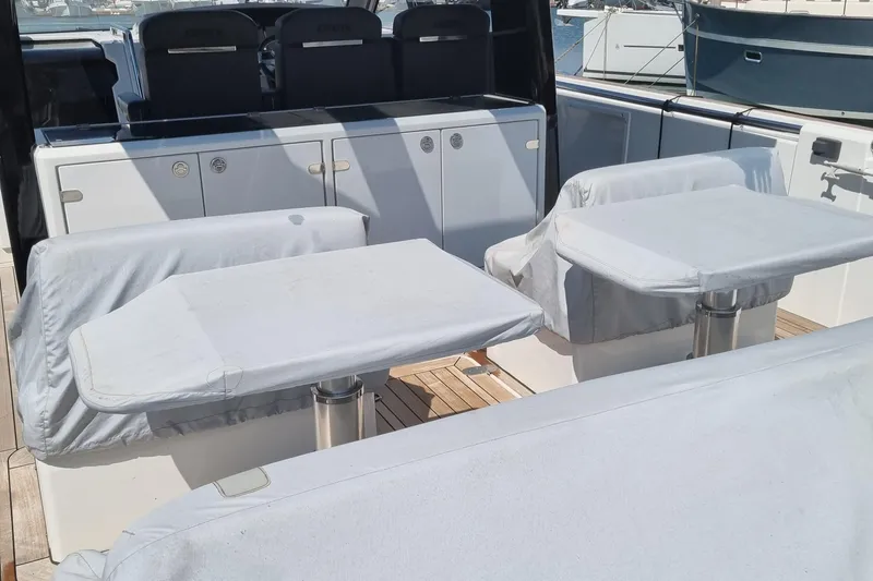  Yacht Photos Pics Covered seating area on a 2019 Fjord 44 Open yacht deck.