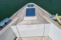 Bow of 2019 Fjord 44 Open yacht with sleek wooden deck design.