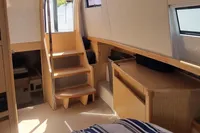Interior of 2019 Fjord 44 Open yacht with wooden stairs and modern furnishings.