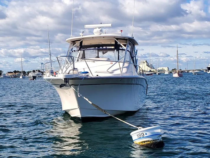Season Pass Yacht Photos Pics 2007 Grady-White Express 330 boat moored in a scenic harbor.
