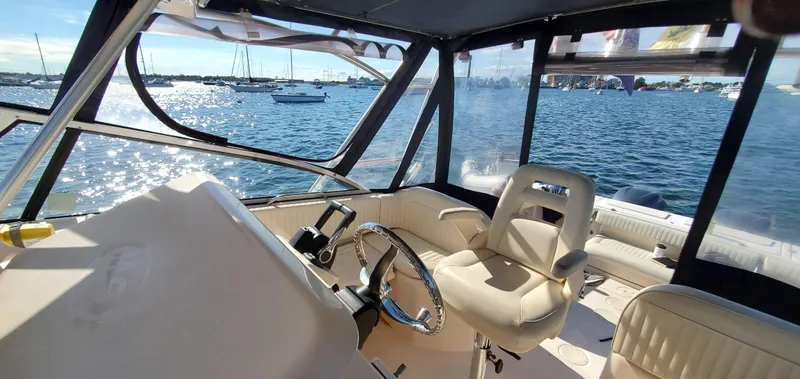 Season Pass Yacht Photos Pics Interior view of 2007 Grady-White Express 330 boat with scenic ocean backdrop.