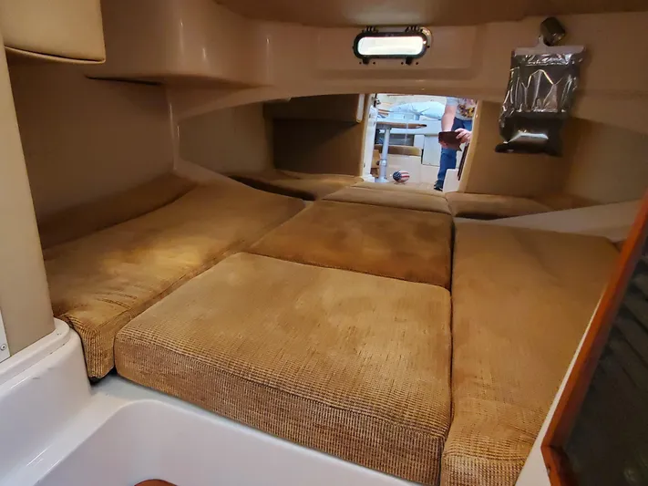 Season Pass Yacht Photos Pics 2007 Grady-White Express 330 cabin interior with cushioned sleeping area.