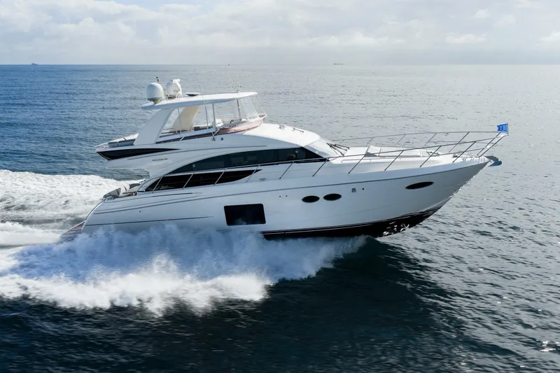 Sea Bandit Yacht Photos Pics 2015 Princess 56 Flybridge Motor Yacht cruising on open water.