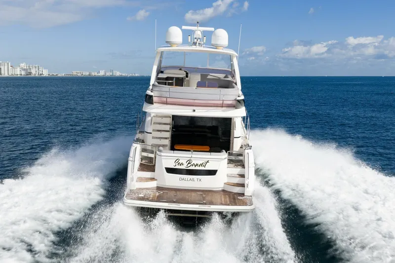 Sea Bandit Yacht Photos Pics 2015 Princess 56 Flybridge Motor Yacht cruising on open water.