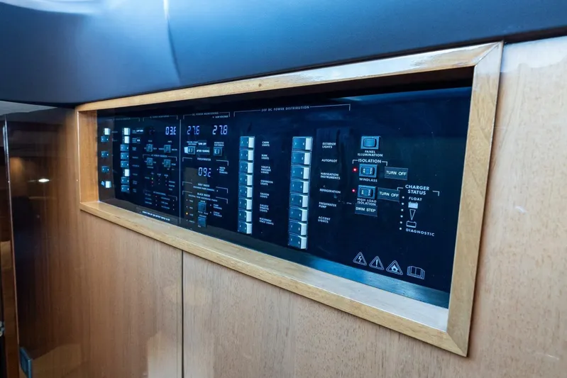 Sea Bandit Yacht Photos Pics Control panel of 2015 Princess 56 Flybridge Motor Yacht, featuring various switches and indicators.