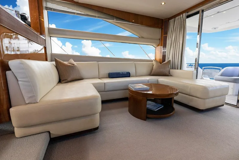 Sea Bandit Yacht Photos Pics Luxurious interior of 2015 Princess 56 Flybridge Yacht with plush seating and ocean view.