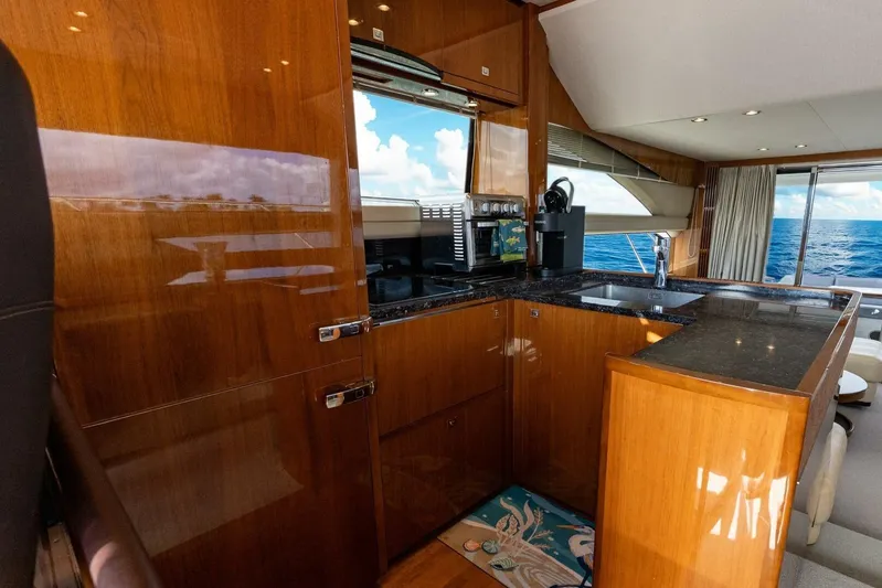 Sea Bandit Yacht Photos Pics Luxurious kitchen interior of 2015 Princess 56 Flybridge Motor Yacht with ocean view.
