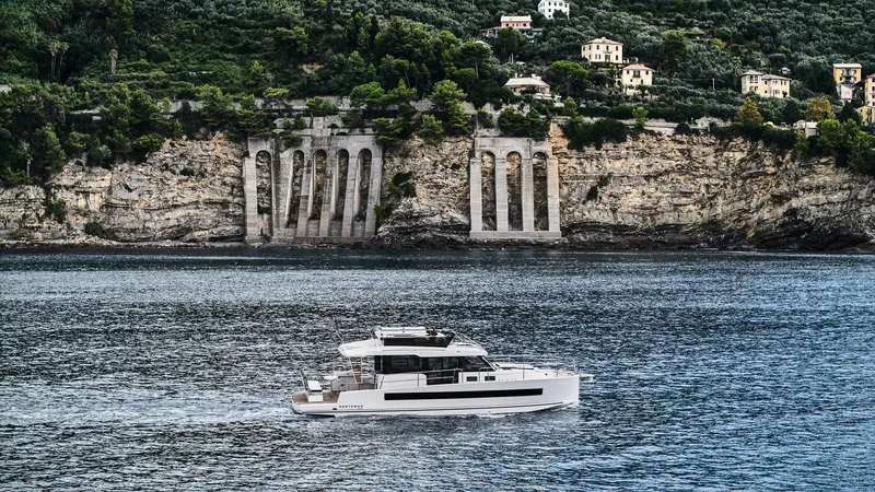  Yacht Photos Pics Modern Northman 1300 yacht cruising near scenic cliffs, 2025 model.