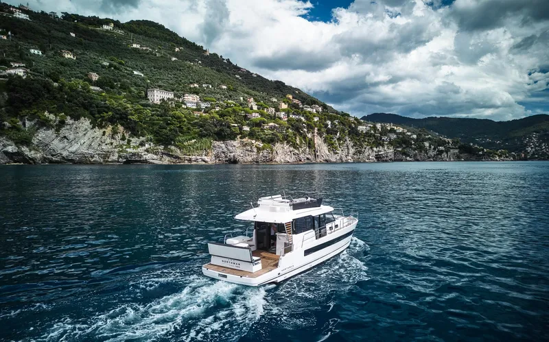  Yacht Photos Pics Luxury Northman 1300 yacht cruising near scenic coastline, 2025 model.