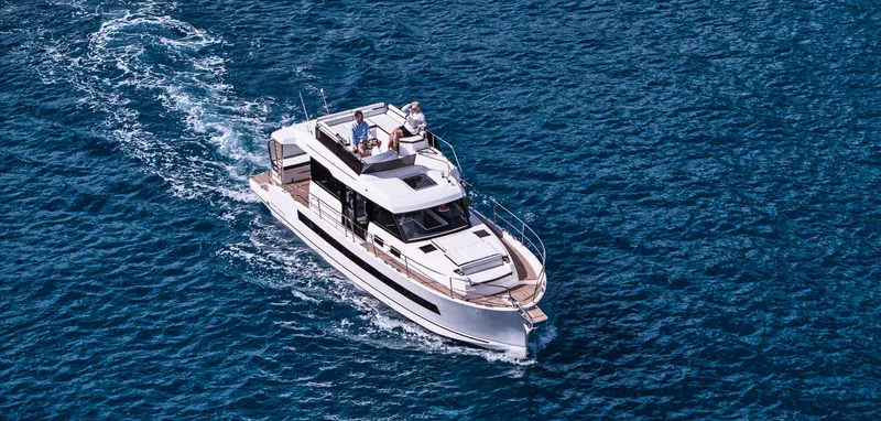  Yacht Photos Pics 2025 Northman 1300 yacht cruising on open blue water.