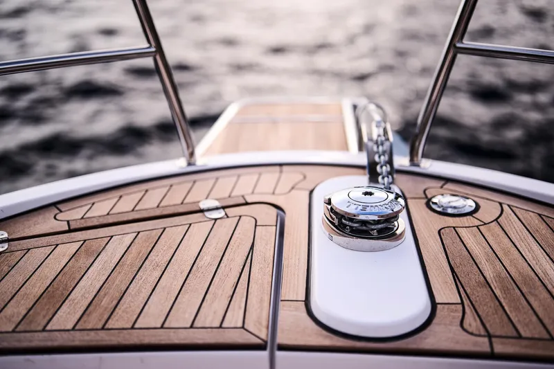  Yacht Photos Pics Deck of 2025 Northman 1300 yacht with wooden finish and metal fittings.