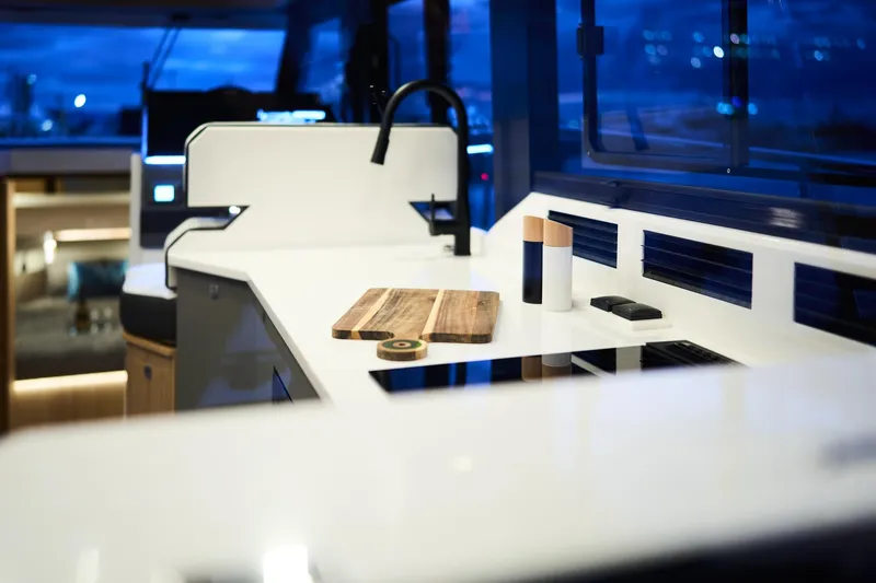  Yacht Photos Pics Modern kitchen interior of 2025 Northman 1300 yacht with sleek countertops and ambient lighting.