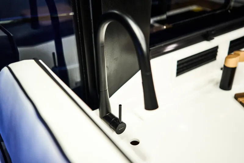  Yacht Photos Pics Modern black faucet on Northman 1300 yacht, 2025 model, sleek and stylish design.