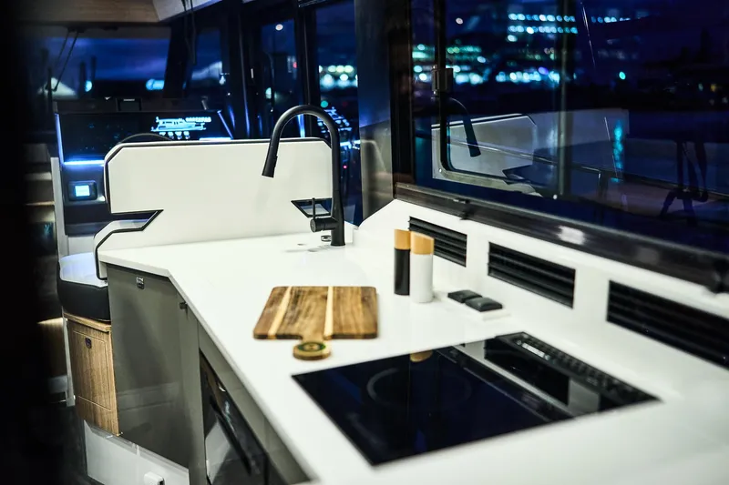  Yacht Photos Pics Modern kitchen interior of 2025 Northman 1300 yacht with sleek design and appliances.