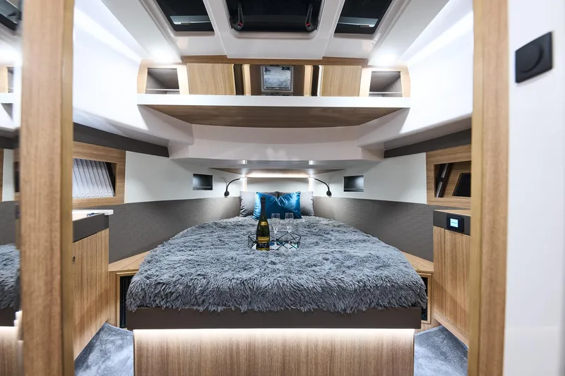  Yacht Photos Pics Luxurious interior of 2025 Northman 1300 yacht with cozy bed and modern design.