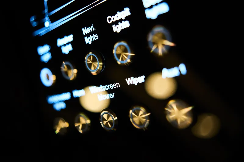  Yacht Photos Pics Close-up of illuminated control panel in 2025 Northman 1300, featuring various labeled buttons and dials.