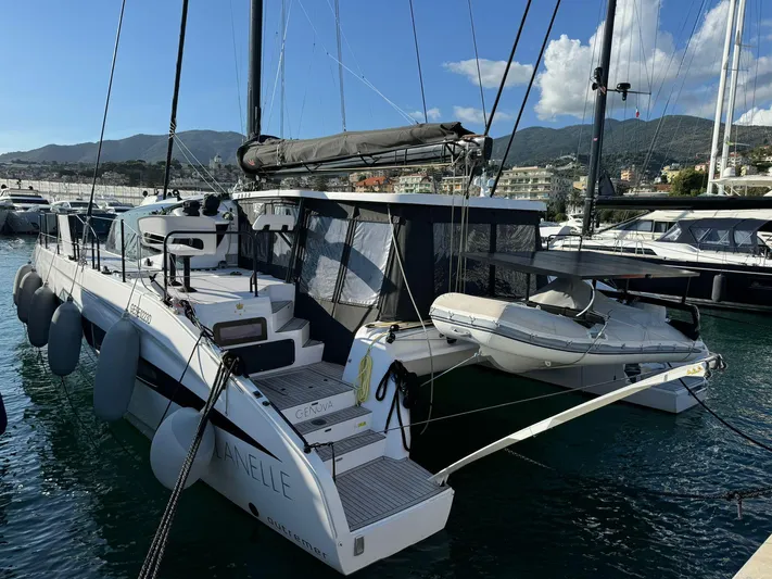  Yacht Photos Pics 2023 Outremer 55 catamaran docked in marina, featuring sleek design and modern amenities.