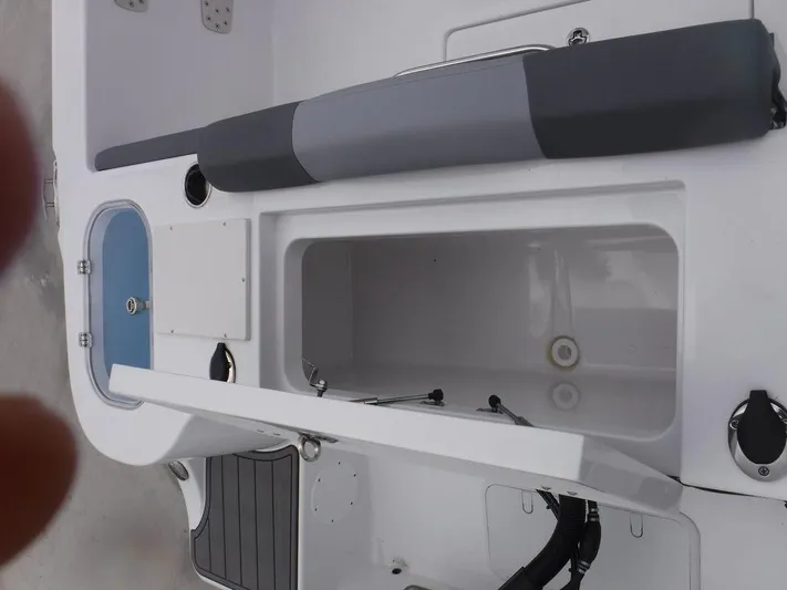  Yacht Photos Pics 2025 NauticStar 292 Legacy boat interior with storage compartments and seating.