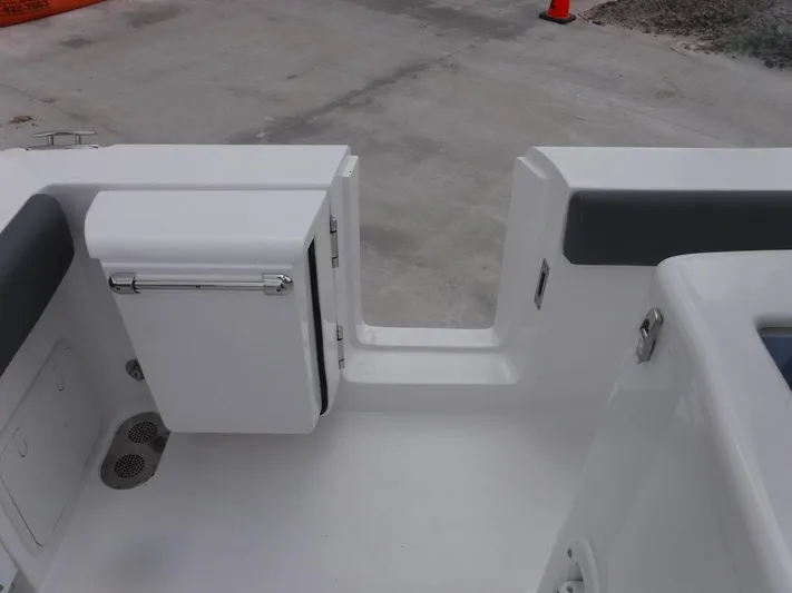  Yacht Photos Pics 2025 NauticStar 292 Legacy boat interior with seating and storage compartment.