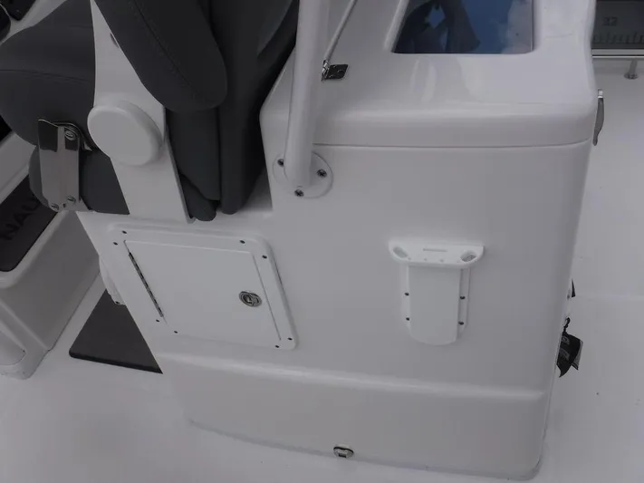 Yacht Photos Pics 2025 NauticStar 292 Legacy boat interior detail with seating and storage compartment.
