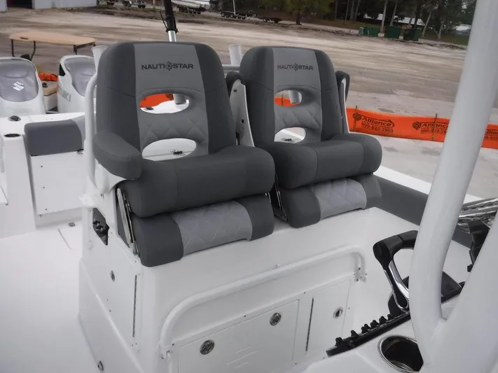  Yacht Photos Pics 2025 NauticStar 292 Legacy boat seats, gray and white, dual helm chairs.