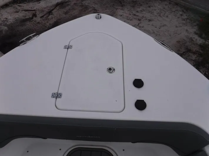  Yacht Photos Pics Bow view of 2025 NauticStar 292 Legacy boat, featuring storage hatch and fittings.