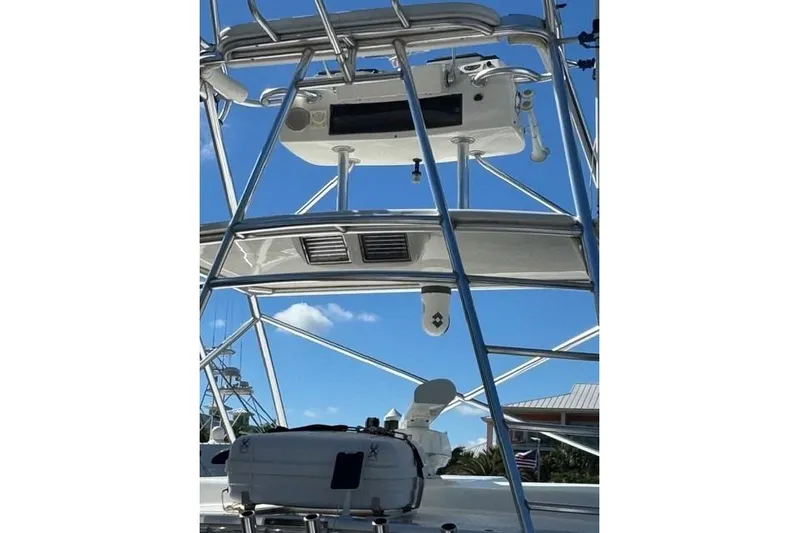 Foam O Yacht Photos Pics 2000 Cabo 45 Express boat tower with clear blue sky background.