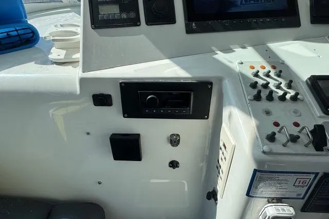 Foam O Yacht Photos Pics Control panel of a 2000 Cabo 45 Express boat with various switches and displays.