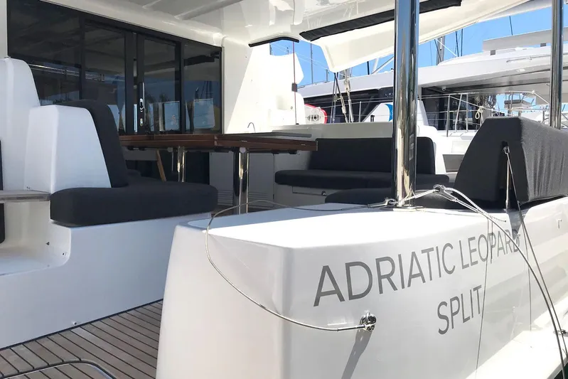  Yacht Photos Pics 2019 Lagoon 50 yacht with spacious seating area, Adriatic Leopard branding.