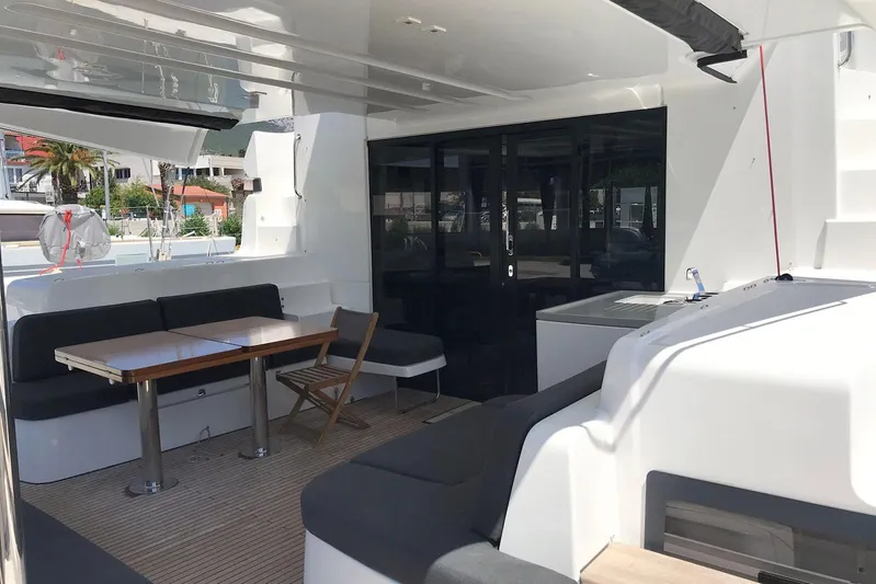  Yacht Photos Pics Spacious deck of 2019 Lagoon 50 catamaran with seating and dining area.