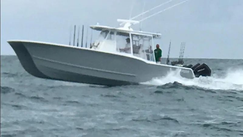  Yacht Photos Pics A 2020 Tideline 365 boat navigating choppy ocean waters.