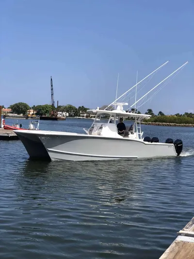  Yacht Photos Pics 2020 Tideline 365 boat cruising on a sunny day in a calm harbor.