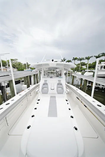  Yacht Photos Pics 2020 Tideline 365 boat with sleek design, docked at marina under cloudy sky.