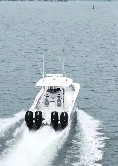  Yacht Photos Pics 2020 Tideline 365 boat cruising on open water with four outboard engines.