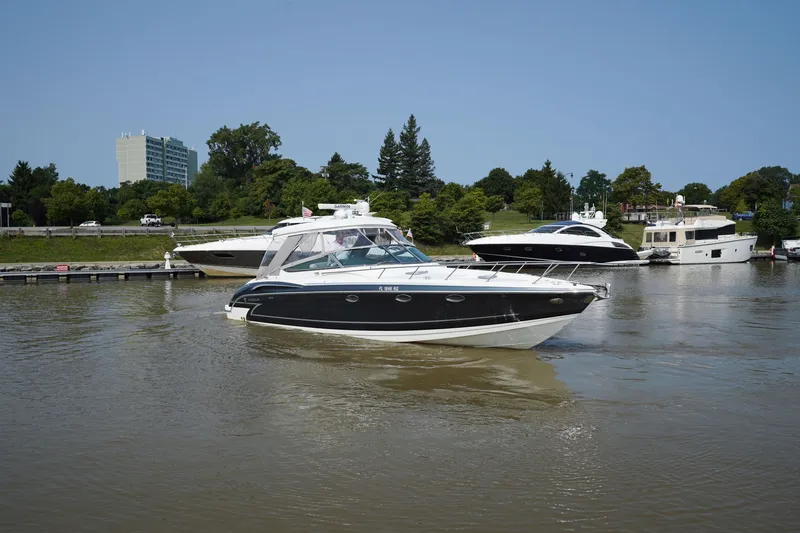 Have A Nice Life Yacht Photos Pics 2017 Formula 370 Super Sport yacht cruising on a calm river near a marina.