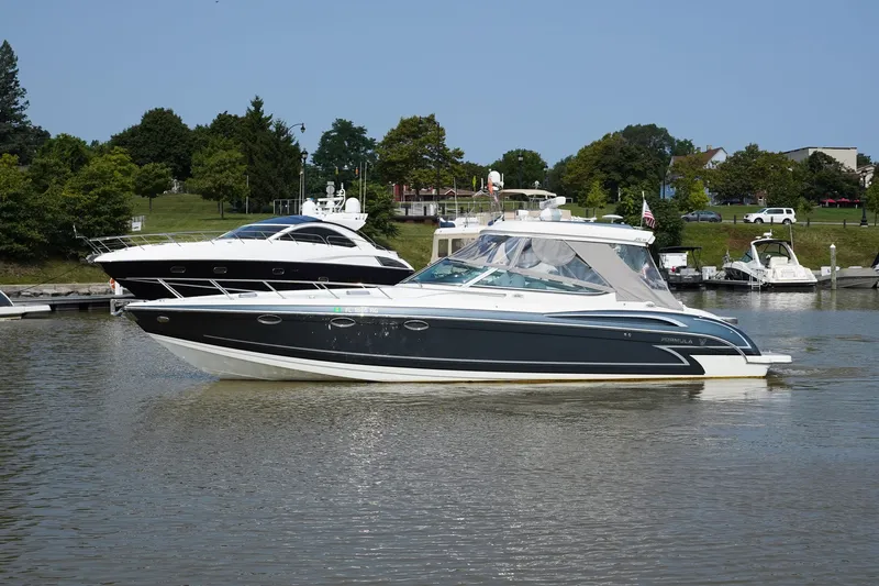 Have A Nice Life Yacht Photos Pics 2017 Formula 370 Super Sport boat cruising on a calm river near a marina.