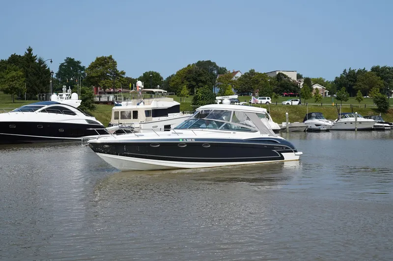 Have A Nice Life Yacht Photos Pics 2017 Formula 370 Super Sport boat cruising on a calm river with other boats nearby.