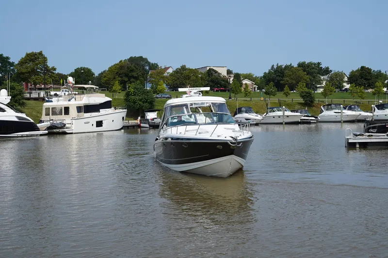 Have A Nice Life Yacht Photos Pics 2017 Formula 370 Super Sport boat cruising in a marina with other yachts.