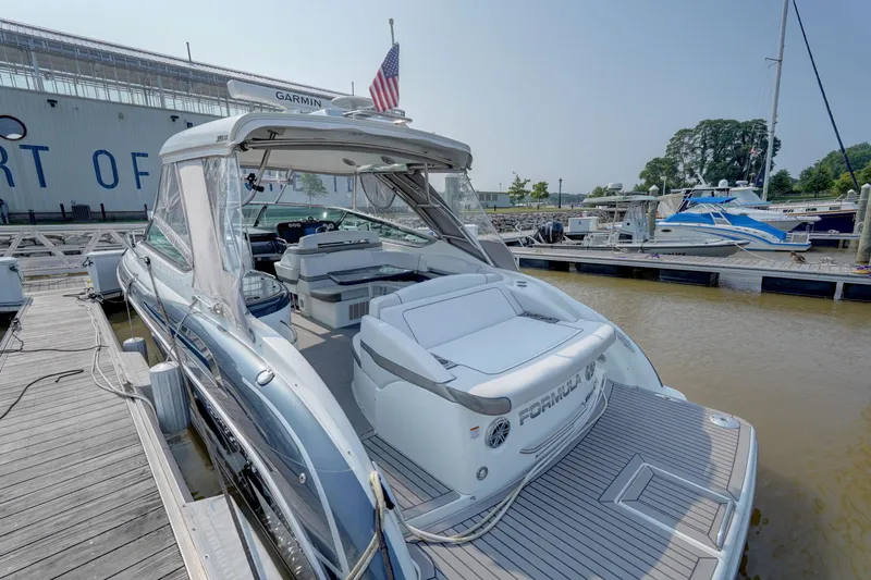 Have A Nice Life Yacht Photos Pics 2017 Formula 370 Super Sport boat docked at marina, rear view with seating area.