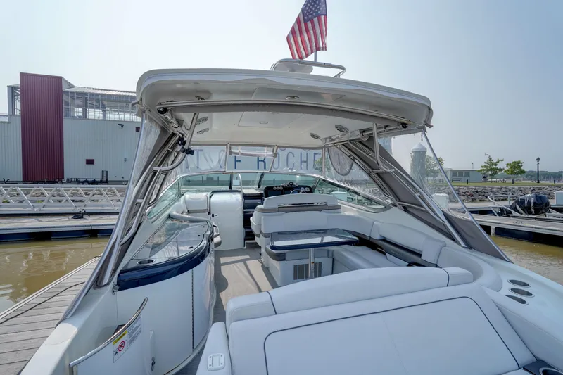 Have A Nice Life Yacht Photos Pics 2017 Formula 370 Super Sport boat with spacious seating and American flag, docked at marina.
