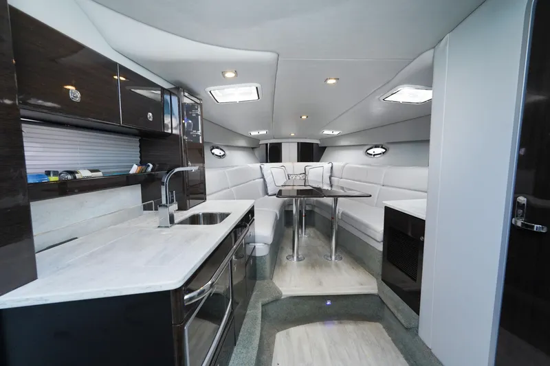 Have A Nice Life Yacht Photos Pics Interior of 2017 Formula 370 Super Sport yacht with modern kitchen and seating area.