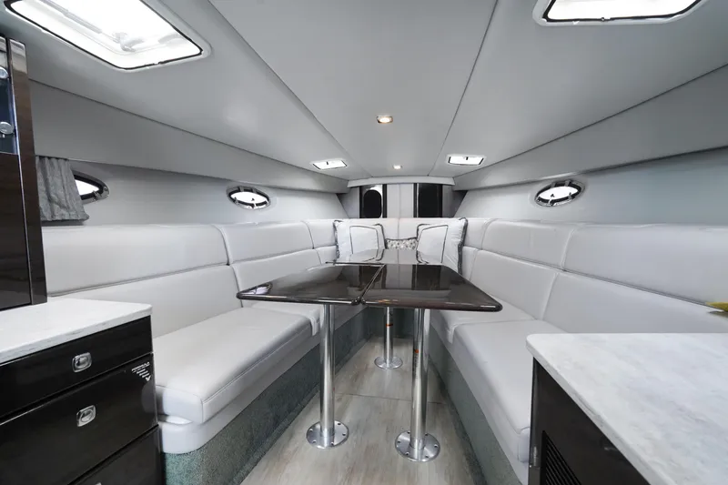 Have A Nice Life Yacht Photos Pics Luxurious interior of a 2017 Formula 370 Super Sport yacht with elegant seating and tables.