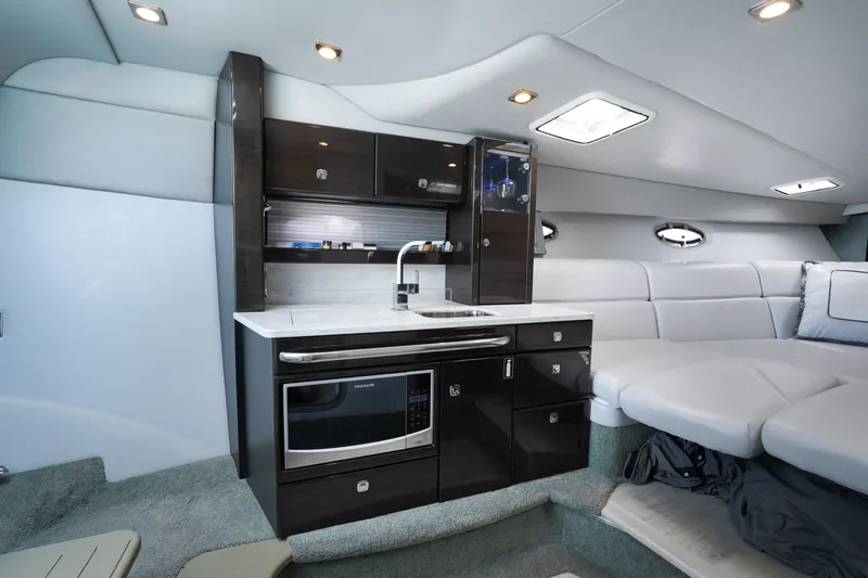 Have A Nice Life Yacht Photos Pics Luxurious interior of 2017 Formula 370 Super Sport yacht with modern kitchenette and seating area.