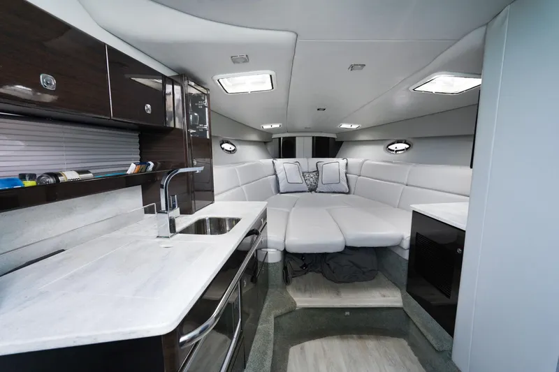 Have A Nice Life Yacht Photos Pics Luxurious interior of 2017 Formula 370 Super Sport yacht with modern kitchen and seating area.