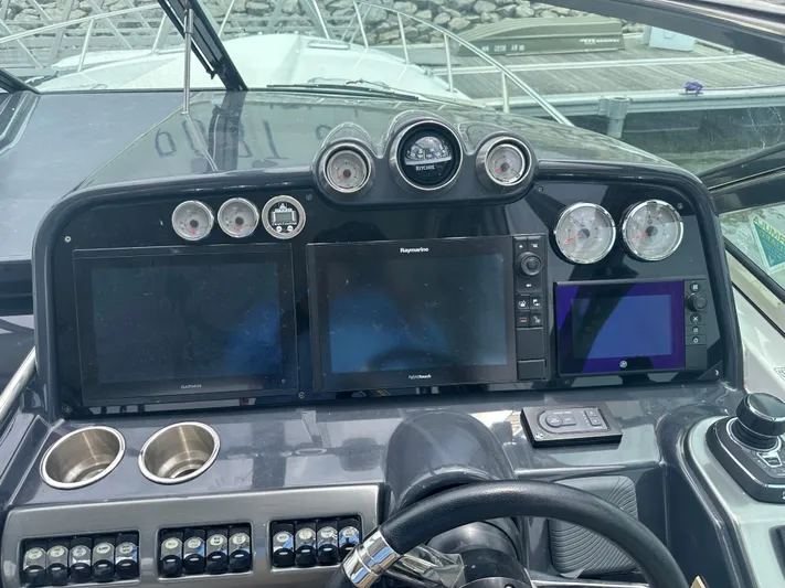 Have A Nice Life Yacht Photos Pics Dashboard of a 2017 Formula 370 Super Sport boat with navigation screens and controls.