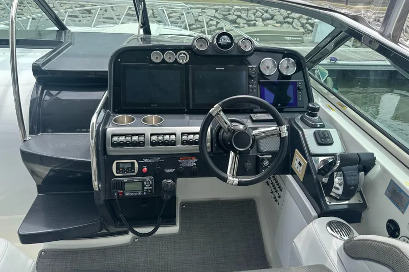 Have A Nice Life Yacht Photos Pics 2017 Formula 370 Super Sport boat dashboard with steering wheel and control panels.