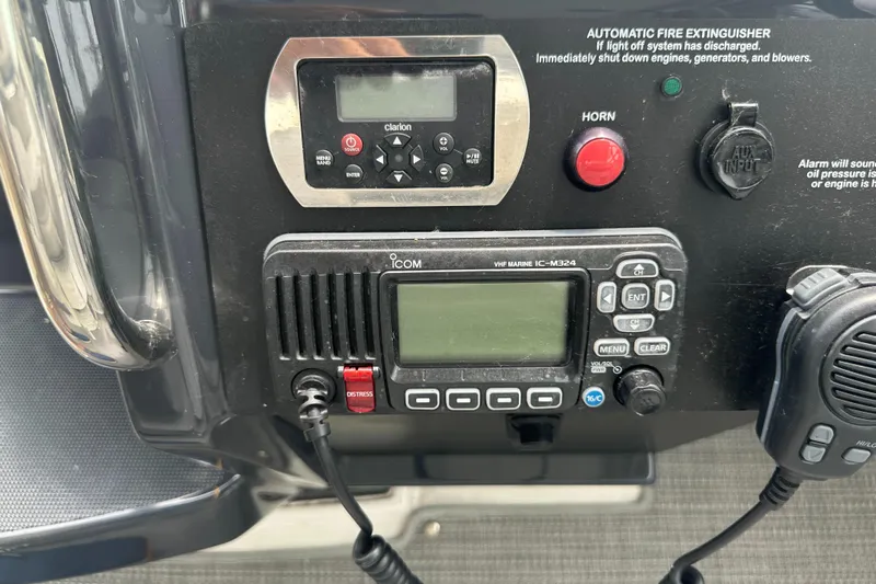 Have A Nice Life Yacht Photos Pics Control panel of a 2017 Formula 370 Super Sport boat with communication and safety equipment.