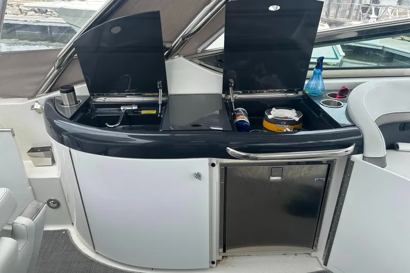 Have A Nice Life Yacht Photos Pics 2017 Formula 370 Super Sport yacht interior with kitchenette and storage compartments.