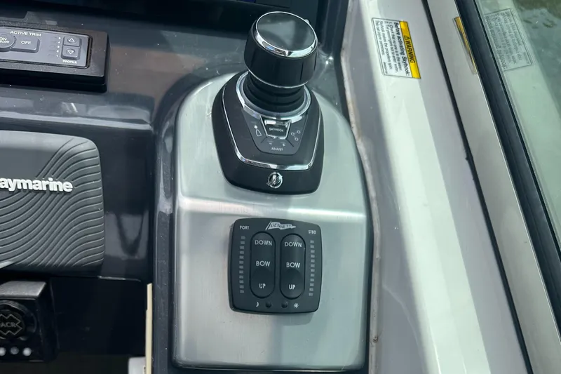 Have A Nice Life Yacht Photos Pics Control panel of a 2017 Formula 370 Super Sport boat with joystick and trim controls.