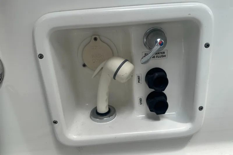 Have A Nice Life Yacht Photos Pics 2017 Formula 370 Super Sport boat water flush system with controls and hose.